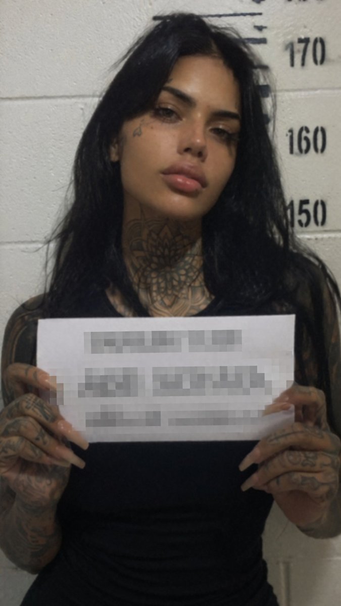 Gritty Tattooed Woman Mugshot preview image