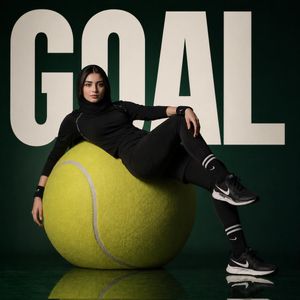 Athlete sitting on a giant tennis ball (preview image)